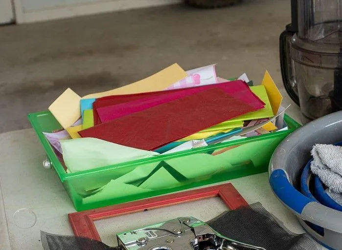 Unused craft supplies in a small bin